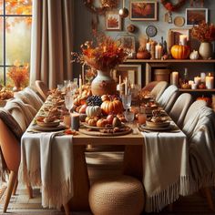 a dining room table set for thanksgiving dinner