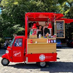 a food cart with two people behind it