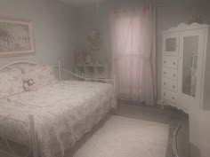 a bedroom with a white bed and pink curtains on the window sill next to a dresser