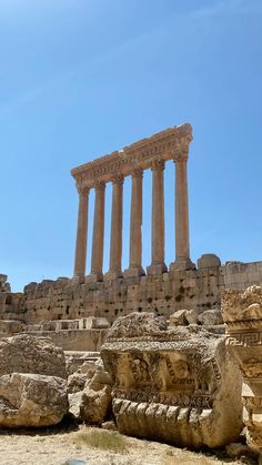 the ruins of an ancient city with columns