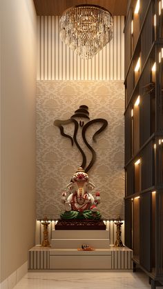 a statue in the middle of a room with chandelier hanging from the ceiling