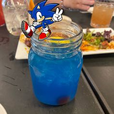 a blue drink sitting on top of a table