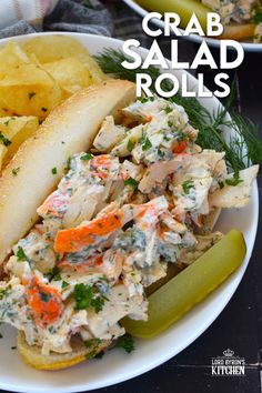 crab salad rolls on a plate with pickles and chips