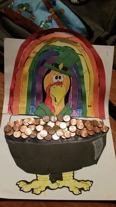 a pot full of coins sitting on top of a table