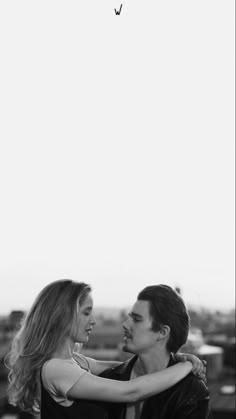 black and white photograph of a couple embracing each other