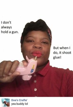 a woman brushing her teeth with an electric toothbrush while holding a pink toy in front of her mouth