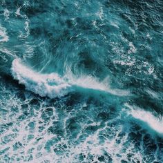an aerial view of the ocean waves