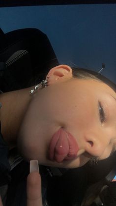 a woman sticking her tongue out and making a face