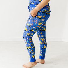 It’s party time! Made from our signature Lunaluxe® Bamboo, these jogger-style PJ pants feature construction trucks, blocks, balloons & more. Pair them with the matching top to make a set, then snag styles for the kiddos to celebrate together! Made from custom-milled Lunaluxe® Bamboo that’s gentle on sensitive or eczema-prone skin Seasonless fabric keeps you cool in the summer & cozy in the winter No interior tags Wide, comfy elastic waistband with an adjustable drawstring Side pockets (Deep enough for a phone!) Easy fit through the hip and thigh Jogger-style ankle cuffs to accommodate different heights Tops sold separately 95% viscose from bamboo; 5% spandex Machine wash cold Little Sleepies is proud to donate a portion of each and every sale to Alex's Lemonade Stand Foundation for Childho Cheap Fun Character Print Sleepwear, Playful Character Print Sleepwear For Bedtime, Womens Pajama Tops, Womens Pjs, Best Pajamas, Mens Pajama Pants, Blue Rainbow, Pj Pants, Womens Pajamas Pants
