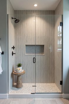 Contemporary walk-in shower in St. Martin, Portugal, featuring a vertical tile shower niche and professional photography. #showerdesign #modernbathroom