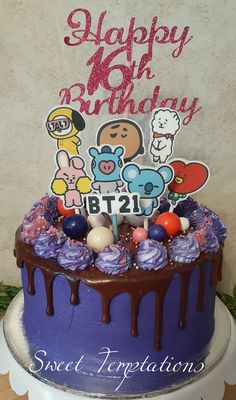 a birthday cake with chocolate icing and decorations