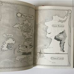 an open book showing the map of game of thrones in it's pages