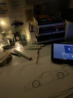a cell phone sitting on top of a table next to some books and pencils
