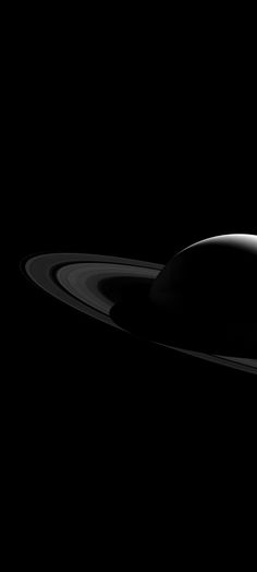 saturn as seen from the hubblee in black and white, taken by nasa's cass spacecraft