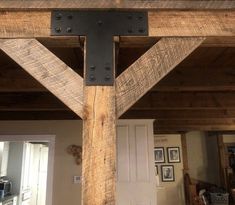 a wooden structure with metal rivets on the top and bottom, in a living room