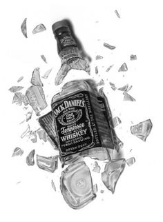 a bottle of jack daniels whiskey on top of broken glass
