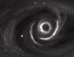 a black hole in the sky with stars around it