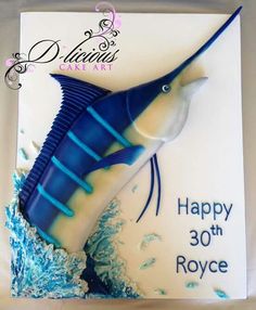 a blue and white cake with a marlin fish on it's side that says happy 30th royce