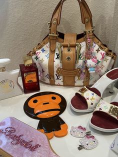 #hellokitty #vintagelouisvuitton #babymilo #murakami Purse Designs, Baby Milo Purse Outfit, Baby Milo Purse, Murakami Purse, Takashi Murakami Purse, Louis Vuitton Takashi Murakami, Louis Vuitton Murakami Outfit, Bape Monkey Purse Outfit, Louis Vuitton X Murakami