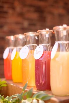 there are many different types of juices on the table