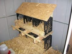 a bird house made out of wood and hay