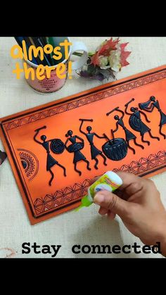 someone is holding up a sticker that says stay connected with dancing people on an orange background