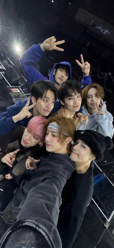 a group of young men standing next to each other