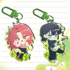 two keychains with anime characters on them, one is green and the other is red