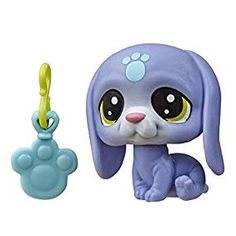 the littlest pet shop has a blue dog with a yellow toy keychain