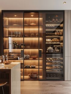 a kitchen with wooden shelves and glass doors