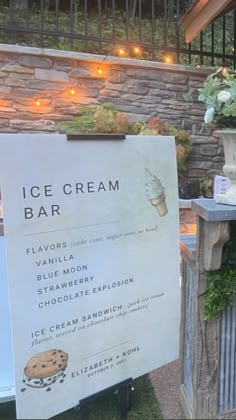 an ice cream bar sign in front of a building