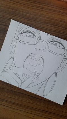 a drawing of a woman with glasses on her face and mouth is shown in front of a piece of paper