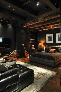 a living room filled with furniture and a flat screen tv mounted to the side of a wall