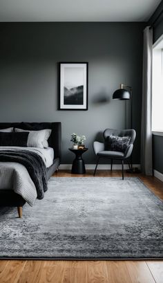 a bedroom with gray walls and wooden floors