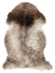 an animal fur pillow on a white background