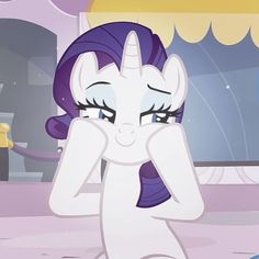 the pony is covering its eyes with her hands while looking at something in front of him