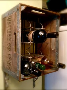 an old wooden box with wine bottles in it