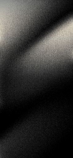 a black and white photo of the surface of an object