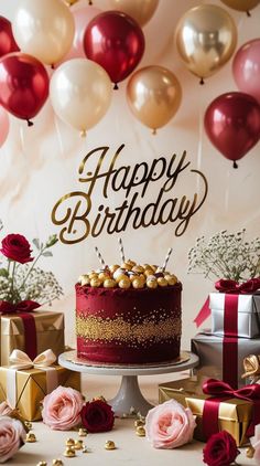 a birthday cake sitting on top of a table next to presents and balloons in the air