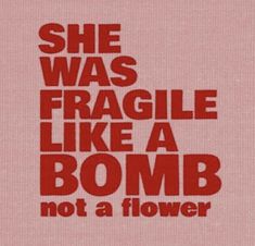 a red poster with the words she was fragile like a bomb, not a flower