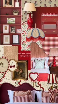 a bedroom decorated in red and white with pictures on the wall