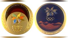 two olympic medals, one gold and the other blue with an image of flowers on it