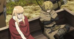 two anime characters sitting on a bench in front of some grass and bushes, one with long blonde hair