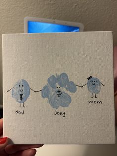 a hand holding up a card with three dogs on it and the words, dad, person, and dog