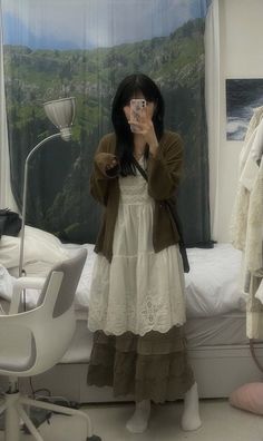 a woman taking a selfie in her bedroom