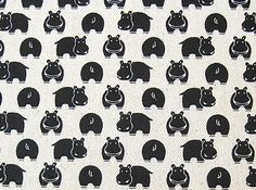 black and white hippos are on the ground