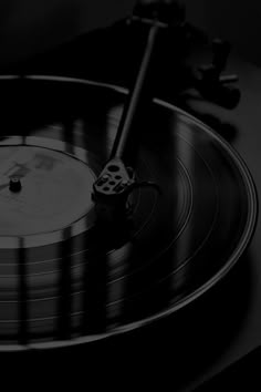 an old record player is playing music on the turntable