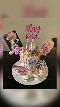 a birthday cake decorated with confetti, sprinkles and wigs