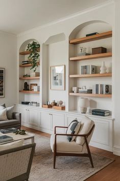 a living room filled with furniture and bookshelves