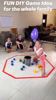 a group of people sitting on the floor playing with balls